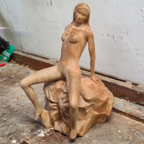 carved wooden erotic statue