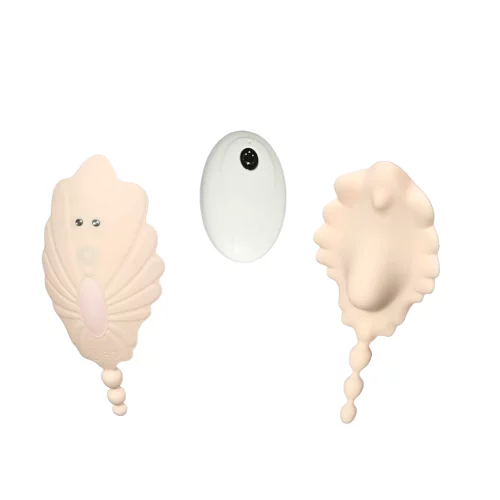 Shell-shaped vibrator stimulating the labia and clitoris
